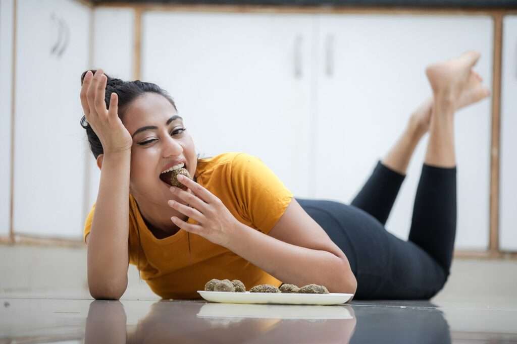 eating, asian woman, lying on the floor-6960077.jpg